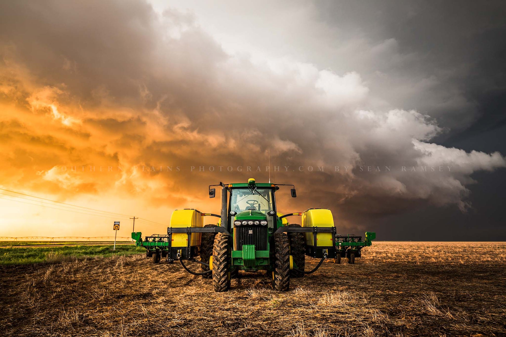 Farm and country photography print of a tractor and storm at sunset on a stormy spring evening in Kansas by Sean Ramsey of Southern Plains Photography.