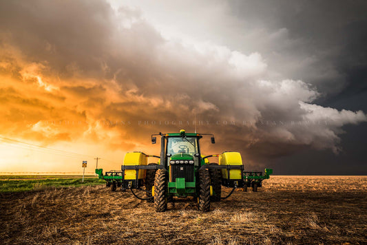 Farm and country photography print of a tractor and storm at sunset on a stormy spring evening in Kansas by Sean Ramsey of Southern Plains Photography.