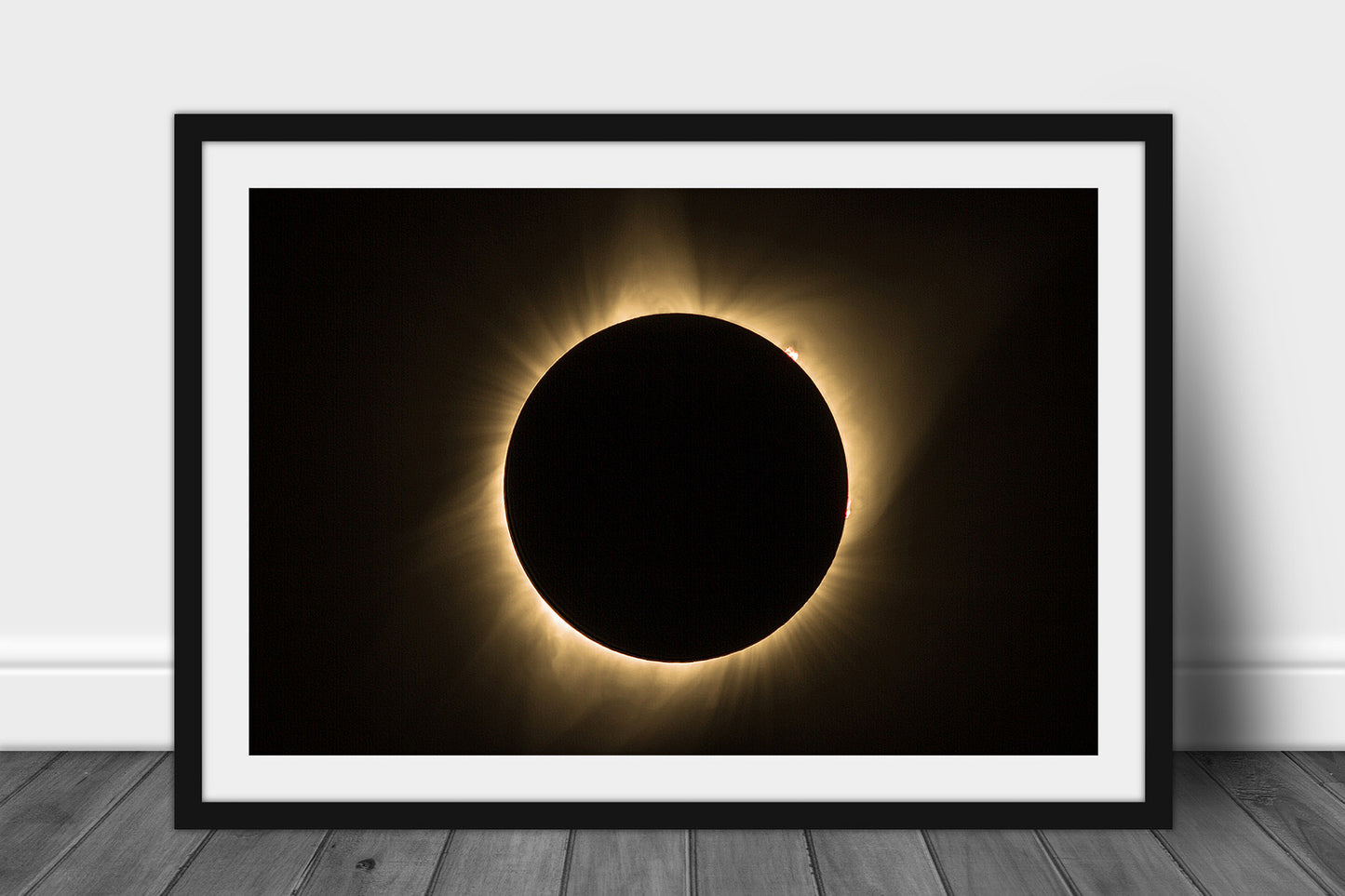 Framed and matted celestial print of a total solar eclipse at totality with visible sun flares captured in Nebraska by Sean Ramsey of Southern Plains Photography.