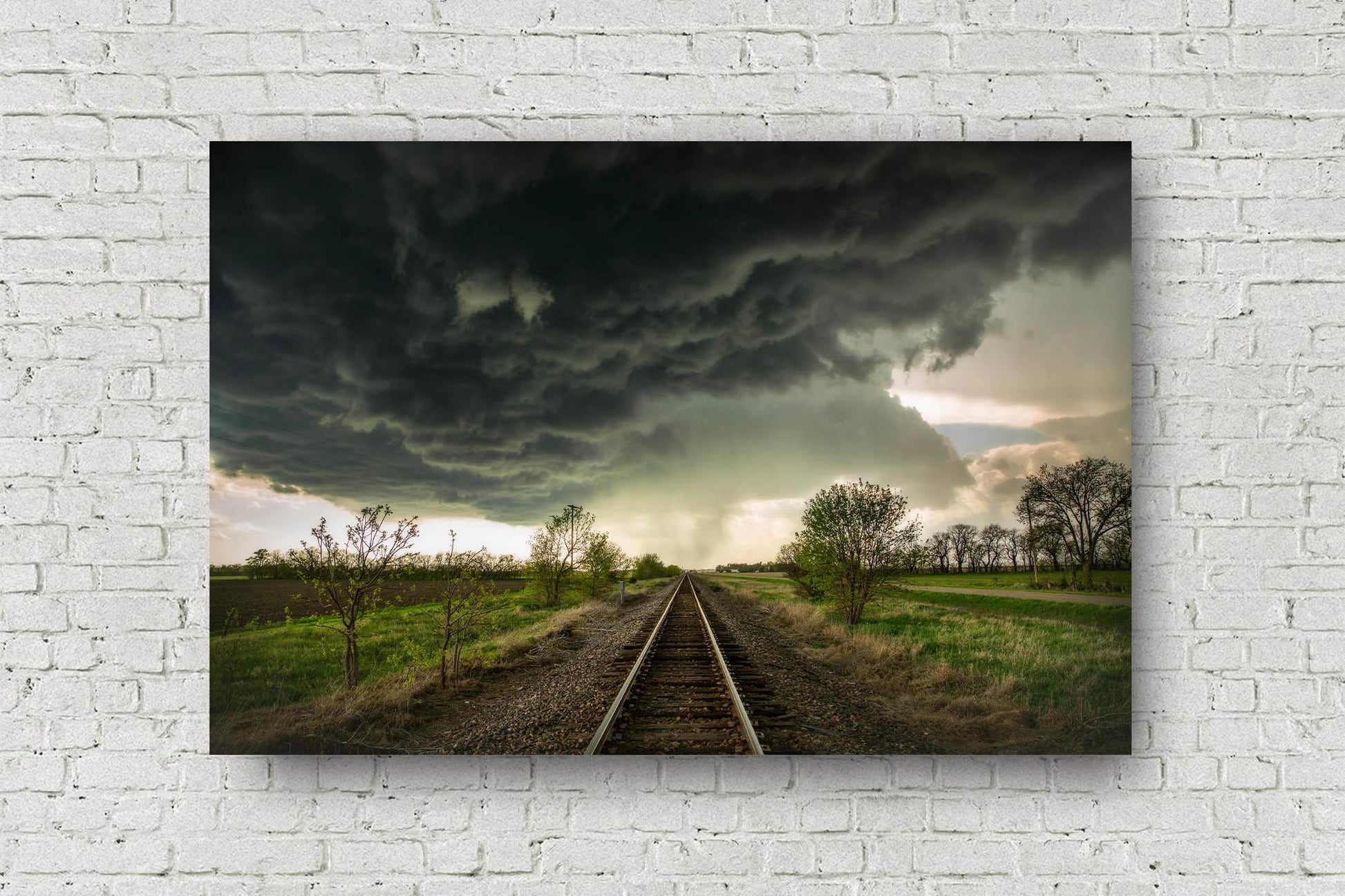 Railroad metal print on aluminum of dark storm clouds over train tracks on a stormy spring day in Kansas by Sean Ramsey of Southern Plains Photography.