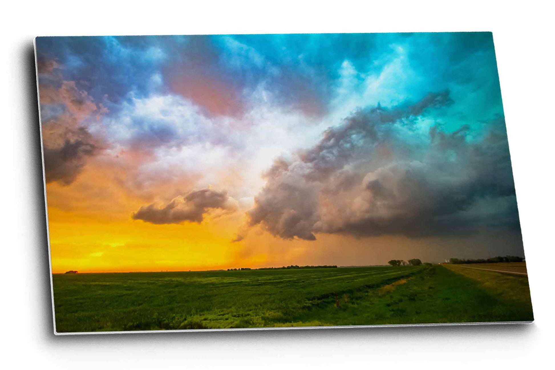 Thunderstorm metal print of colorful storm clouds over a field at sunset on a stormy spring evening in Kansas by Sean Ramsey of Southern Plains Photography.