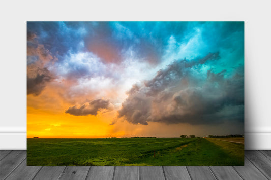 Thunderstorm metal print of colorful storm clouds over a field at sunset on a stormy spring evening in Kansas by Sean Ramsey of Southern Plains Photography.