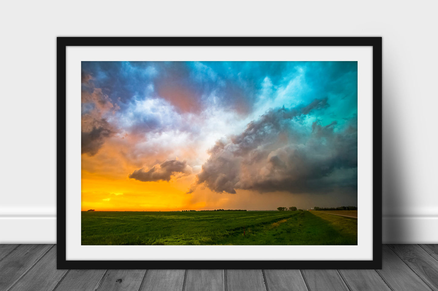 Framed and matted thunderstorm photography print of colorful storm clouds at sunset on a spring evening in Kansas by Sean Ramsey of Southern Plains Photography.