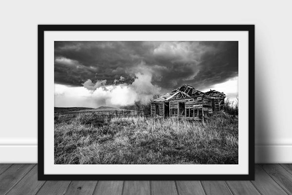 Black and white framed print with optional mat of an abandoned hhouse and passing thunderstorm on a stormy spring day on the Kansas prairie by Sean Ramsey of Southern Plains Photography.