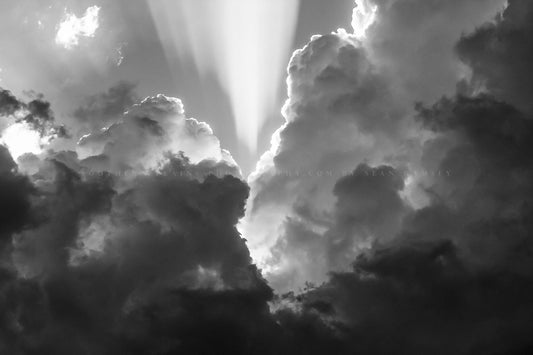 Inspirational photography print of sunbeams bursting high into the sky from storm clouds on a stormy spring day in Oklahoma in black and white by Sean Ramsey of Southern Plains Photography.