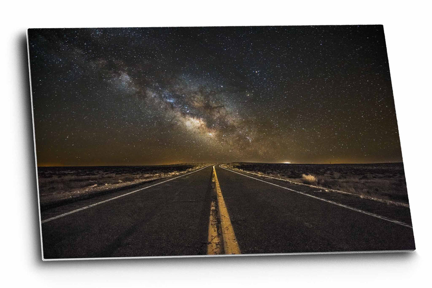 Celestial metal print of a highway leading to the Milky Way as it rises on the horizon on a starry night in the Arizona desert by Sean Ramsey of Southern Plains Photography.