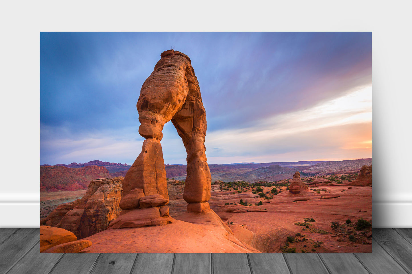 Western landscape metal print of Delicate Arch glowing in evening sunlight at sunset in Arches National Park near Moab, Utah by Sean Ramsey of Southern Plains Photography.