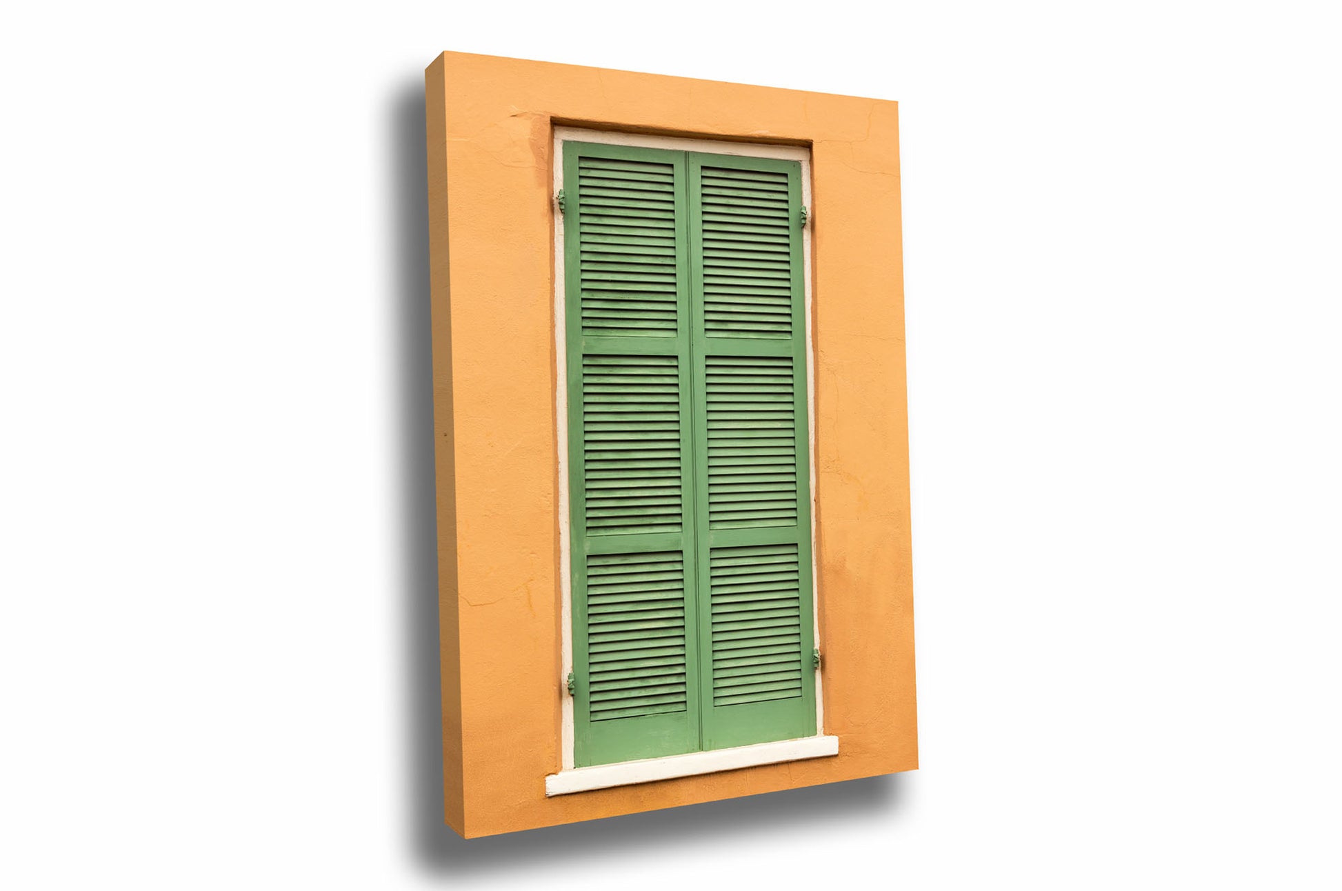 NOLA vertical canvas wall art of green shutters against an orange wall showing off the architecture found in the French Quarter in New Orleans, Louisiana by Sean Ramsey of Southern Plains Photography.