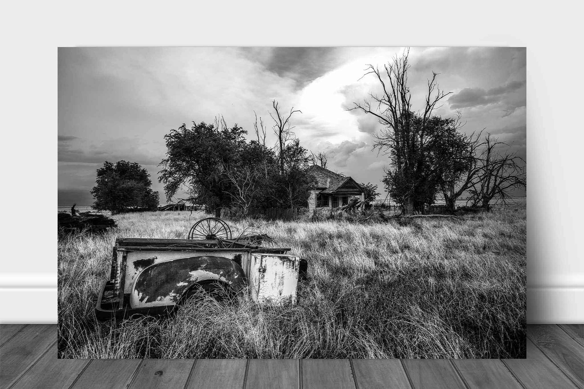 Black and white country metal print on aluminum of a rusty pickup bed in the front yard of an abandoned house in the Oklahoma panhandle by Sean Ramsey of Southern Plains Photography.