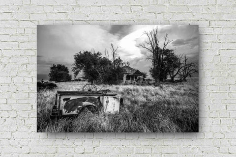 Black and white country metal print on aluminum of a rusty pickup bed in the front yard of an abandoned house in the Oklahoma panhandle by Sean Ramsey of Southern Plains Photography.