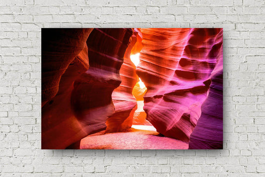 Southwestern metal print of Antelope Canyon walls shaped as an hourglass leading to sunlight in the Arizona desert by Sean Ramsey of Southern Plains Photography.