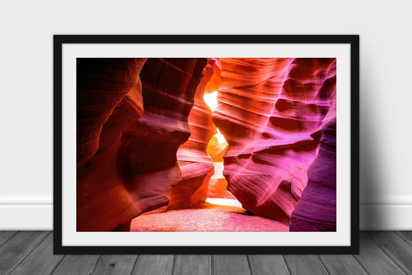 Framed southwestern photography print of Antelope Canyon walls shaped as an hourglass leading to sunlight in the Arizona desert by Sean Ramsey of Southern Plains Photography.