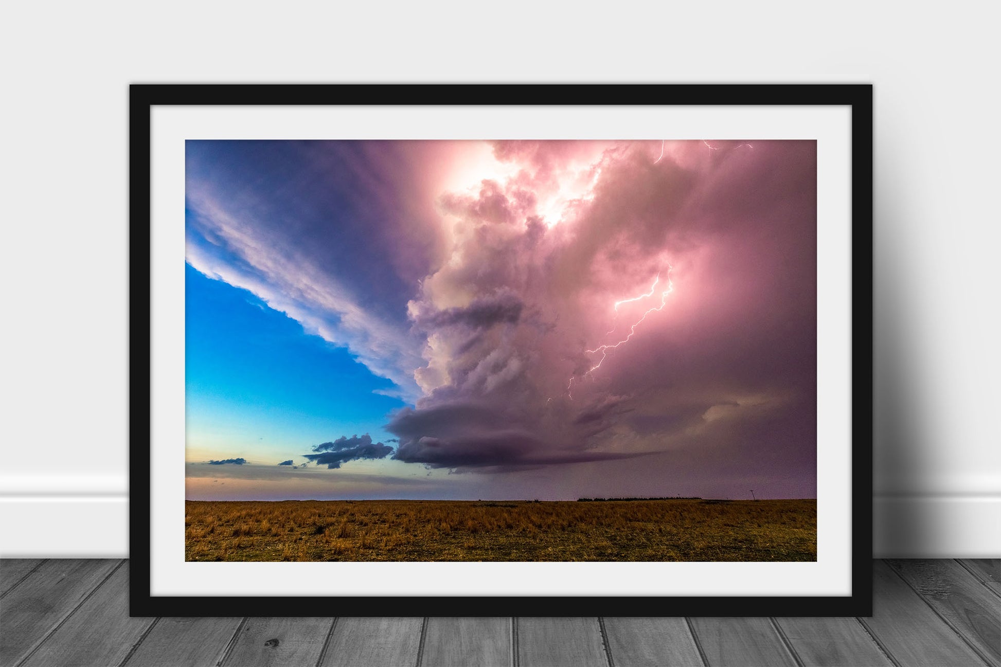 Framed and matted storm print of a supercell thunderstorm illuminated by lightning on a stormy spring evening in Kansas by Sean Ramsey of Southern Plains Photography.