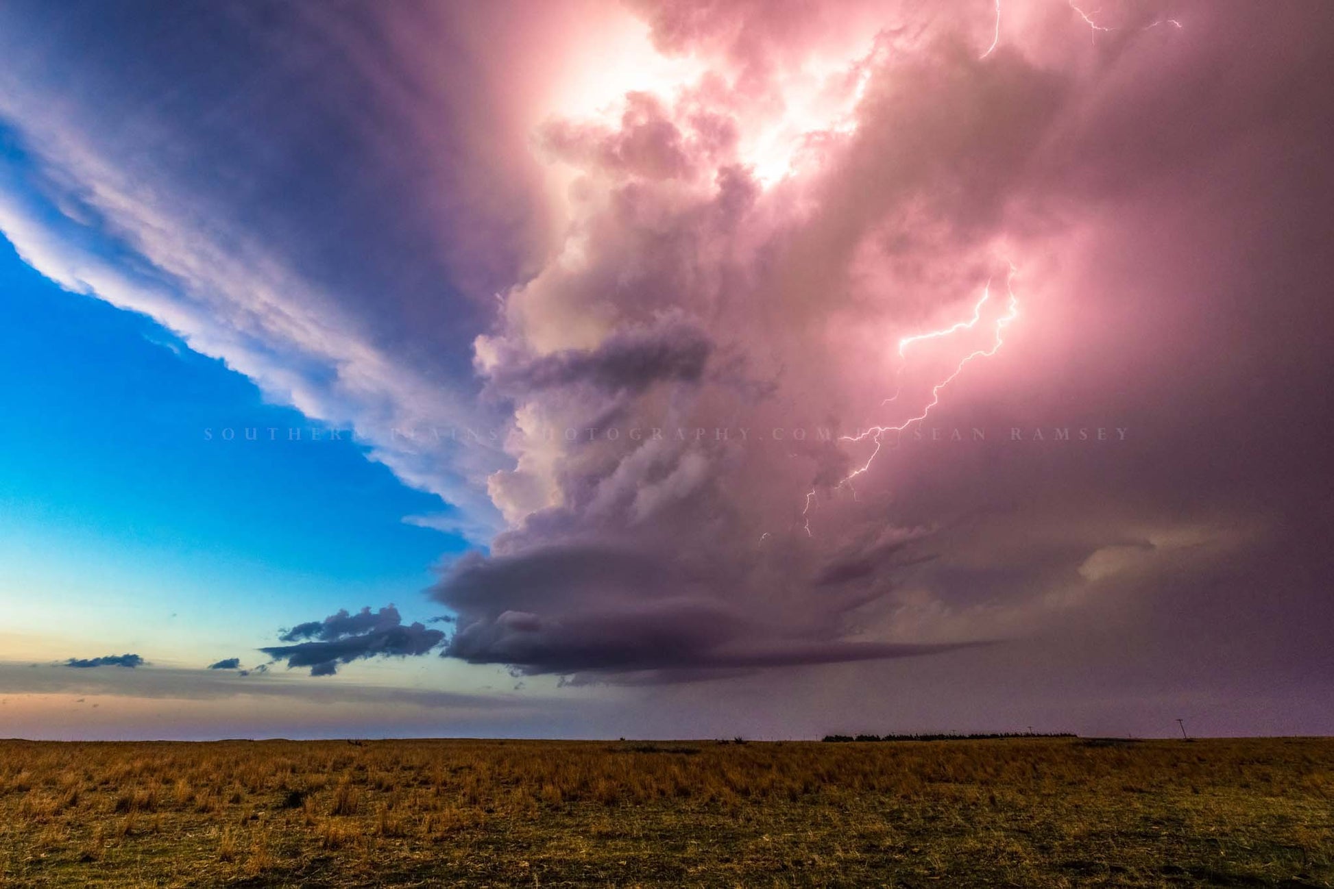 Storm photography print of a supercell thunderstorm illuminated by lightning at dusk on a stormy spring evening in Kansas by Sean Ramsey of Southern Plains Photography.