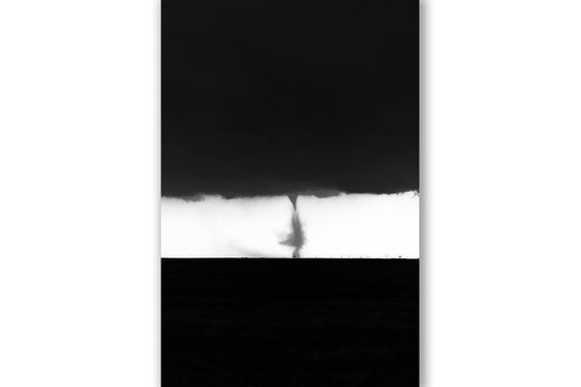 Vertical black and white storm photography print of a tornado twisting over the prairie against a sunlit sky on a stormy spring day in Texas by Sean Ramsey of Southern Plains Photography.