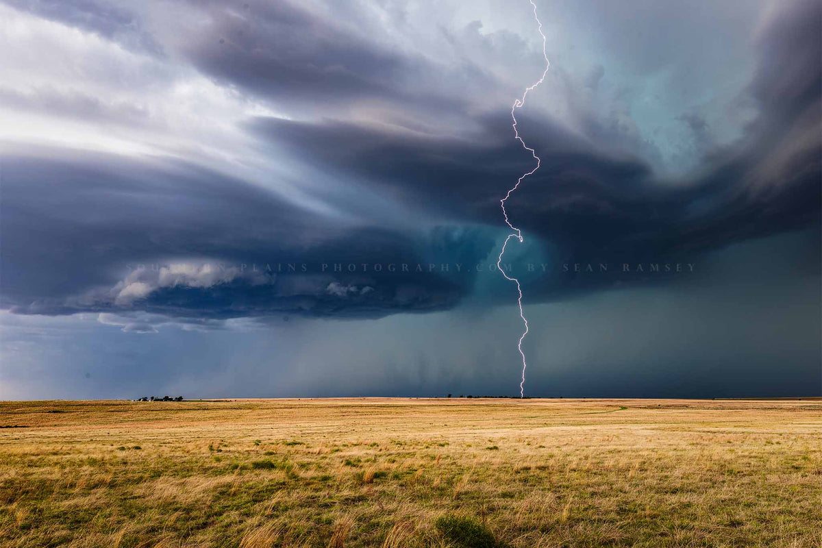 Storm photography print of a lightning bolt winding its way to the ground from a supercell thunderstorm on a stormy day in Oklahoma by Sean Ramsey of Southern Plains Photography.