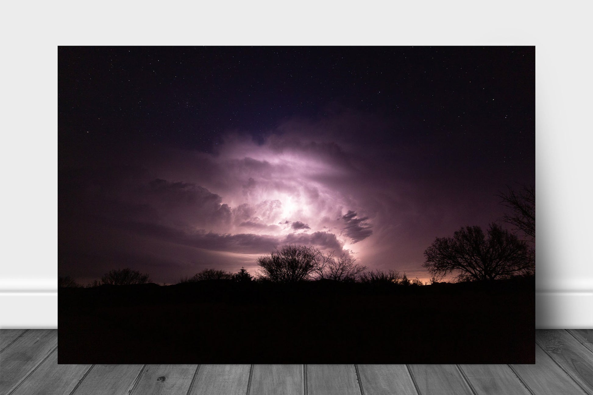 Storm aluminum metal print wall art of a thunderstorm illuminated by lightning while stars twinkle above on a stormy night in Oklahoma by Sean Ramsey of Southern Plains Photography.