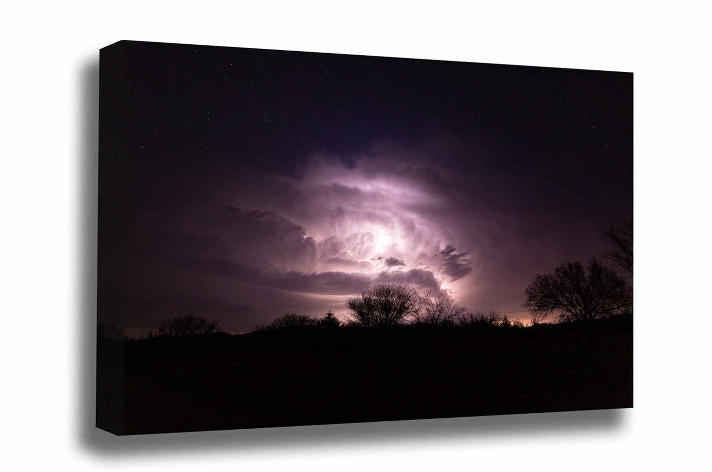 Storm gallery wrapped canvas wall art of a thunderstorm illuminated by lightning while stars twinkle above on a stormy night in Oklahoma by Sean Ramsey of Southern Plains Photography.