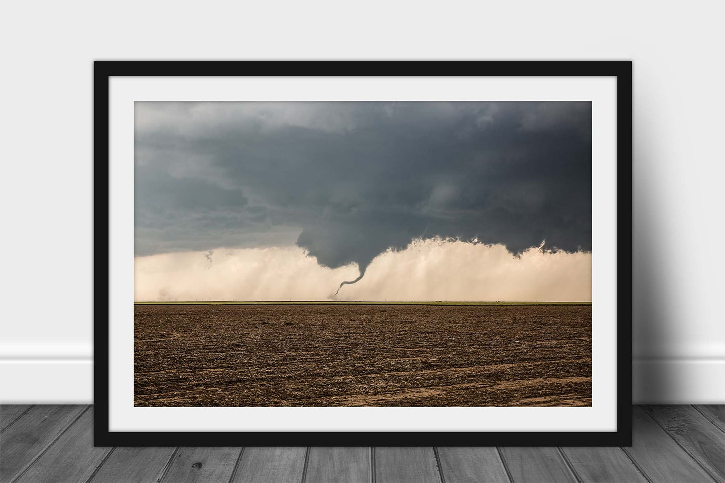 Framed storm print of a tornado dancing in a dirt field on a stormy spring day in Kansas by Sean Ramsey of Southern Plains Photography.