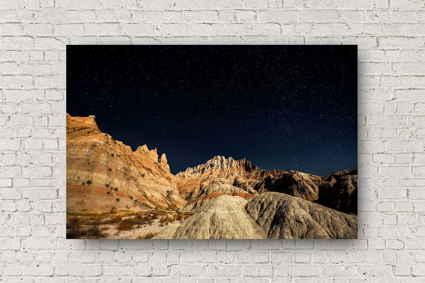 Great Plains metal print of a starry night sky over pinnacles in Badlands National Park, South Dakota by Sean Ramsey of Southern Plains Photography.
