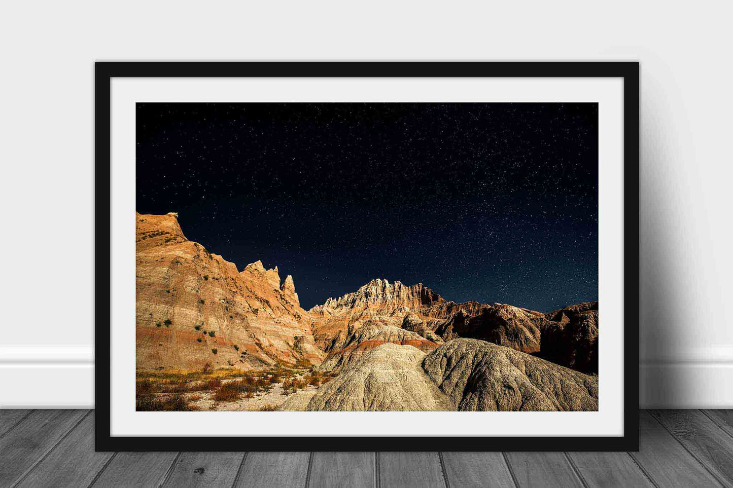 Framed Great Plains print of a starry night sky over pinnacles in Badlands National Park, South Dakota by Sean Ramsey of Southern Plains Photography.