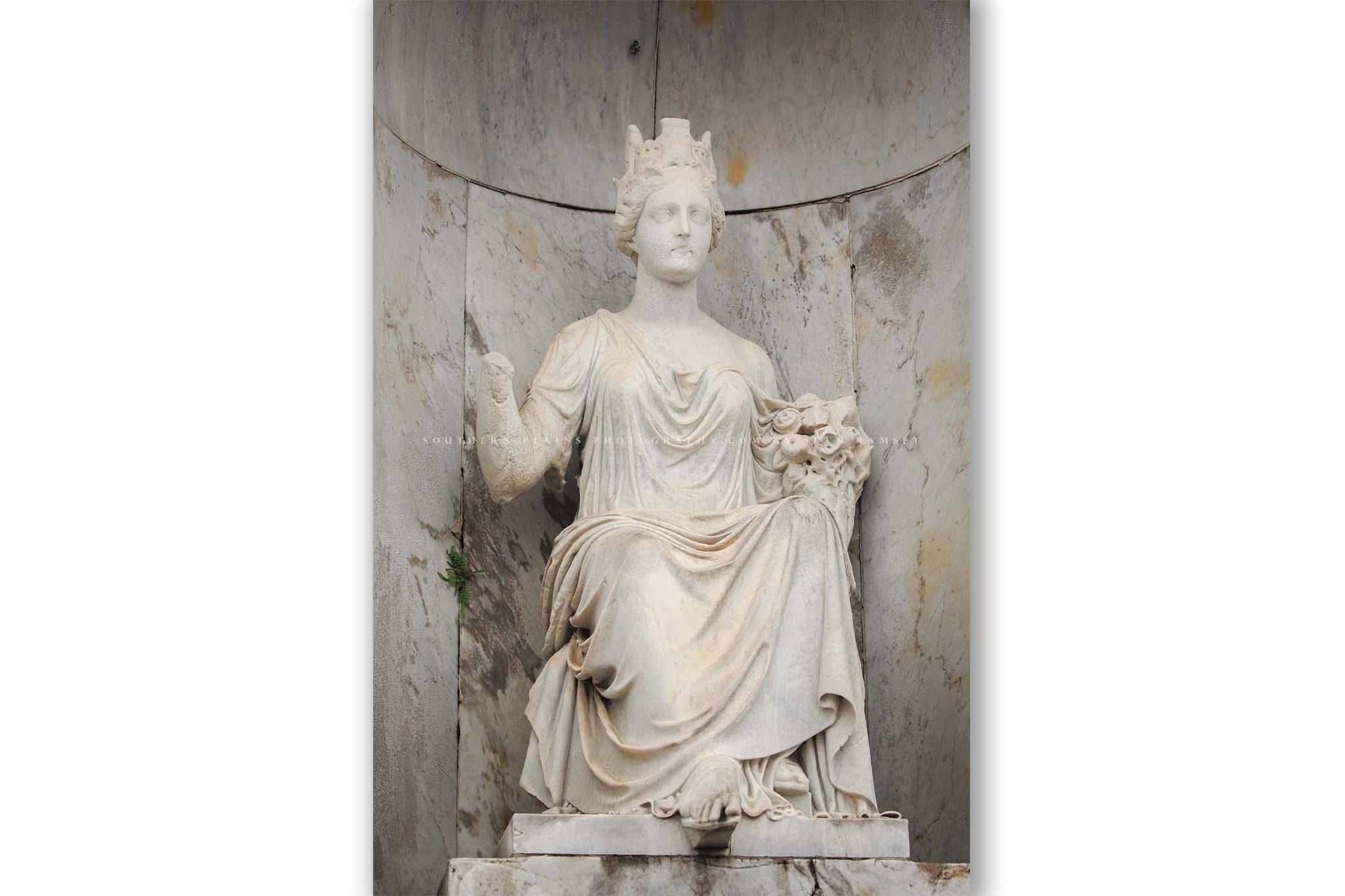 Vertical NOLA photography print of a statue at a tomb in St. Louis Cemetery No. 1 in New Orleans, Louisiana by Sean Ramsey of Southern Plains Photography.