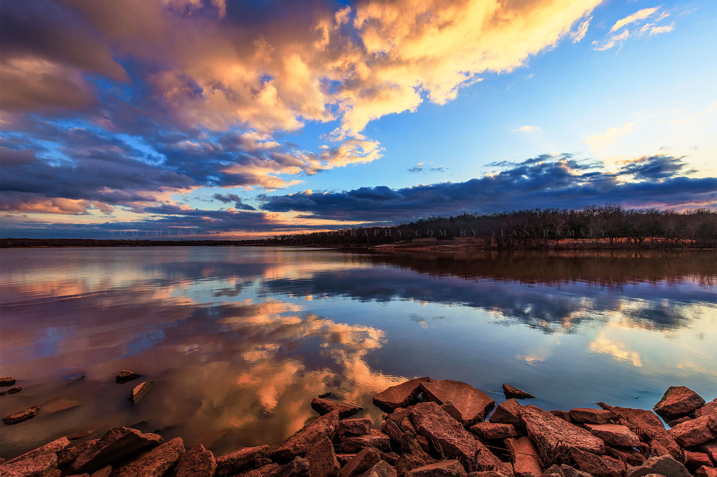 Landscape photography print of clouds reflecting off the still waters of Lake Arcadia at sunset near Edmond, Oklahoma by Sean Ramsey of Southern Plains Photography.