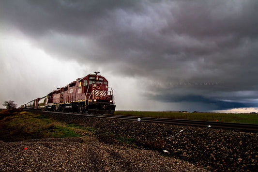 Railroad photography print of a train emerging from a thunderstorm on an early winter day in Oklahoma by Sean Ramsey of Southern Plains Photography.