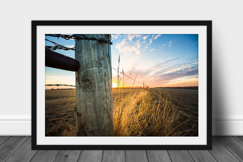 Framed country print with optional mat of a fence post and prairie grass illuminated in golden sunlight at sunset on a chilly winter evening in Oklahoma by Sean Ramsey of Southern Plains Photography.