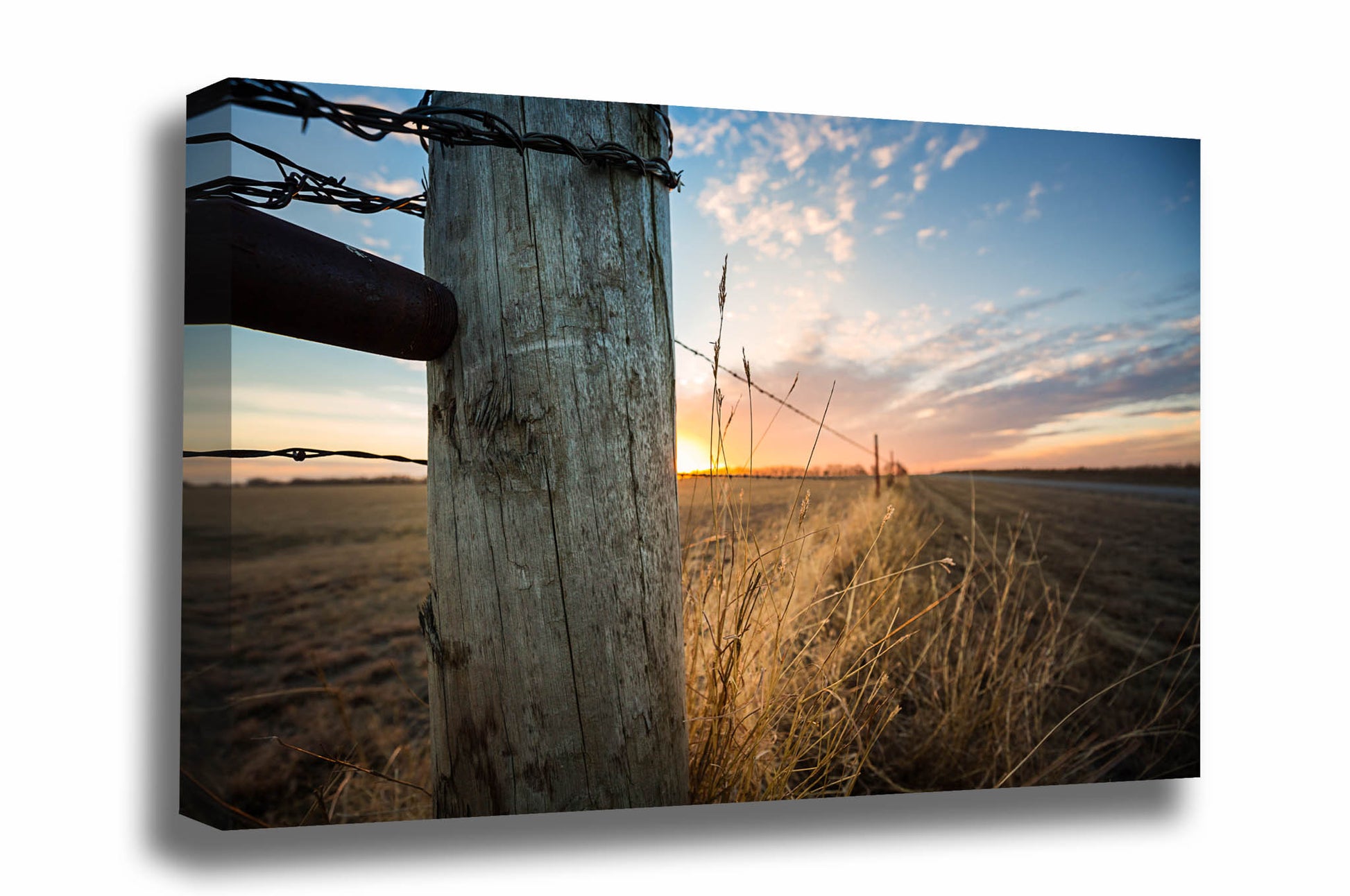 Country canvas wall art of a fence post and prairie grass in golden sunlight at sunset on a chilly winter evening in Oklahoma by Sean Ramsey of Southern Plains Photography.
