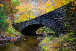 Country photography print of an old stone bridge surrounded by fall color on an autumn day in the Great Smoky Mountains near Gatlinburg, Tennessee by Sean Ramsey of Southern Plains Photography.