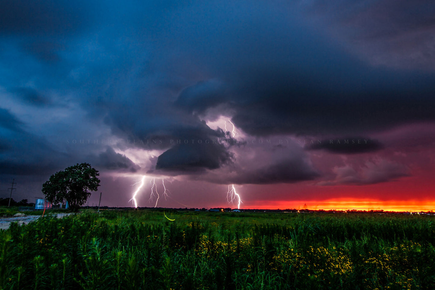 Storm photography print of lightning strikes as a firefly whirls about at sunset on a stormy summer evening in Oklahoma by Sean Ramsey of Southern Plains Photography.