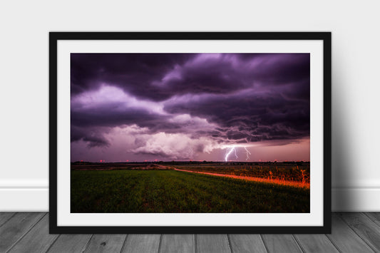 Framed and matted storm print of a lightning strike as a wall cloud forms on a stormy night on the plains of Kansas by Sean Ramsey of Southern Plains Photography.