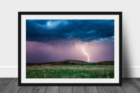 Framed storm print with optional mat of a lightning strike near a hill at dusk on a stormy spring night in Kansas by Sean Ramsey of Southern Plains Photography.