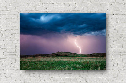 Storm metal print of lightning striking near a hill on a stormy spring evening on the plains of Kansas by Sean Ramsey of Southern Plains Photography.