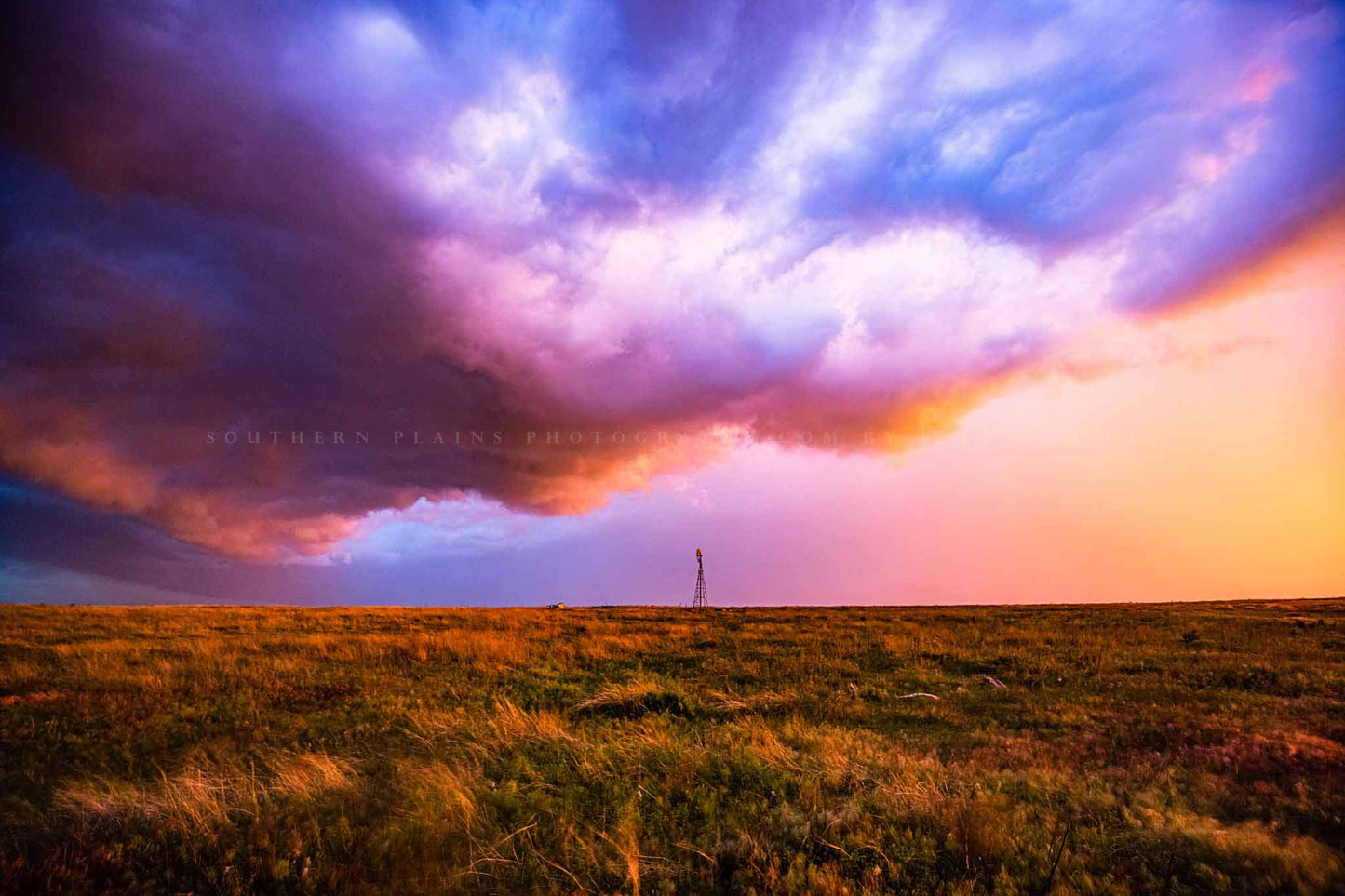 Country photography print of colorful storm clouds over an old windmill on a stormy spring evening in Oklahoma by Sean Ramsey of Southern Plains Photography.