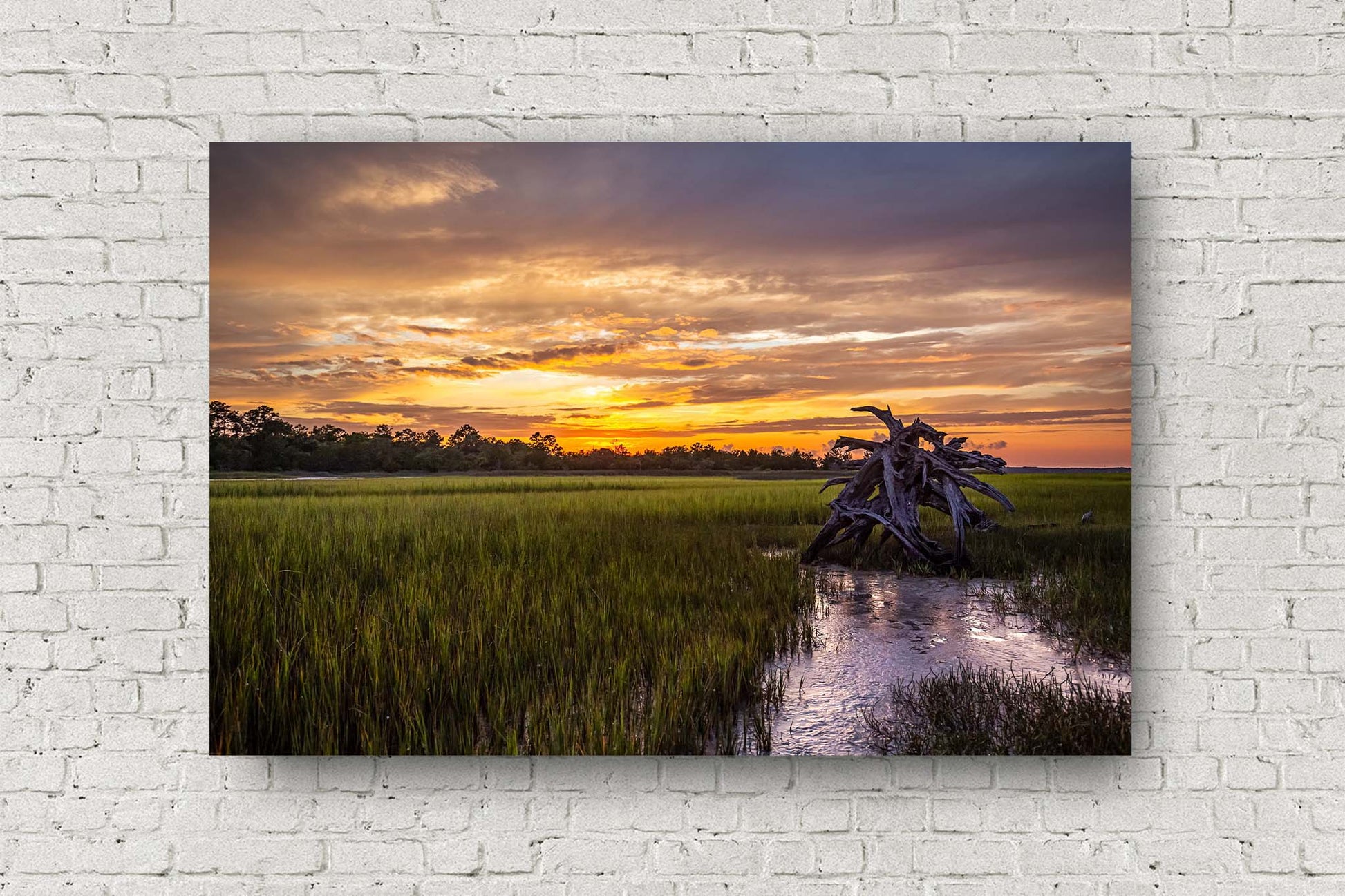 Coastal metal print of a warm sunset taking place over a salt marsh on a summer evening in the lowcountry of South Carolina by Sean Ramsey of Southern Plains Photography.