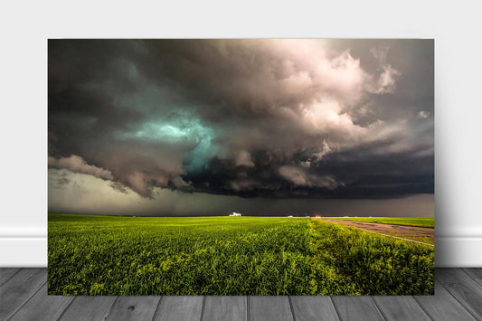Storm metal print on aluminum of a thunderstorm twisting its way over a farmhouse on a stormy spring day on the plains of Colorado by Sean Ramsey of Southern Plains Photography.