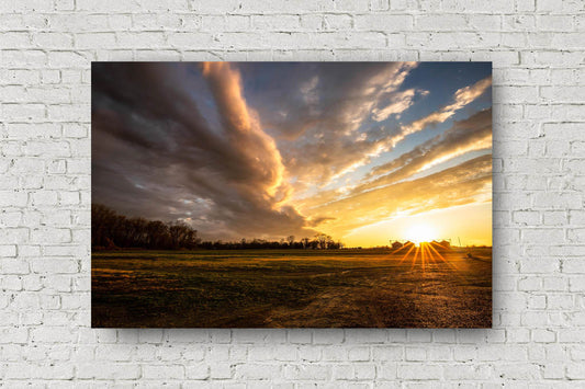 Southeastern metal print wall art of a warm sunset over a farm after a stormy day in the Mississippi Delta in Mississippi by Sean Ramsey of Southern Plains Photography.