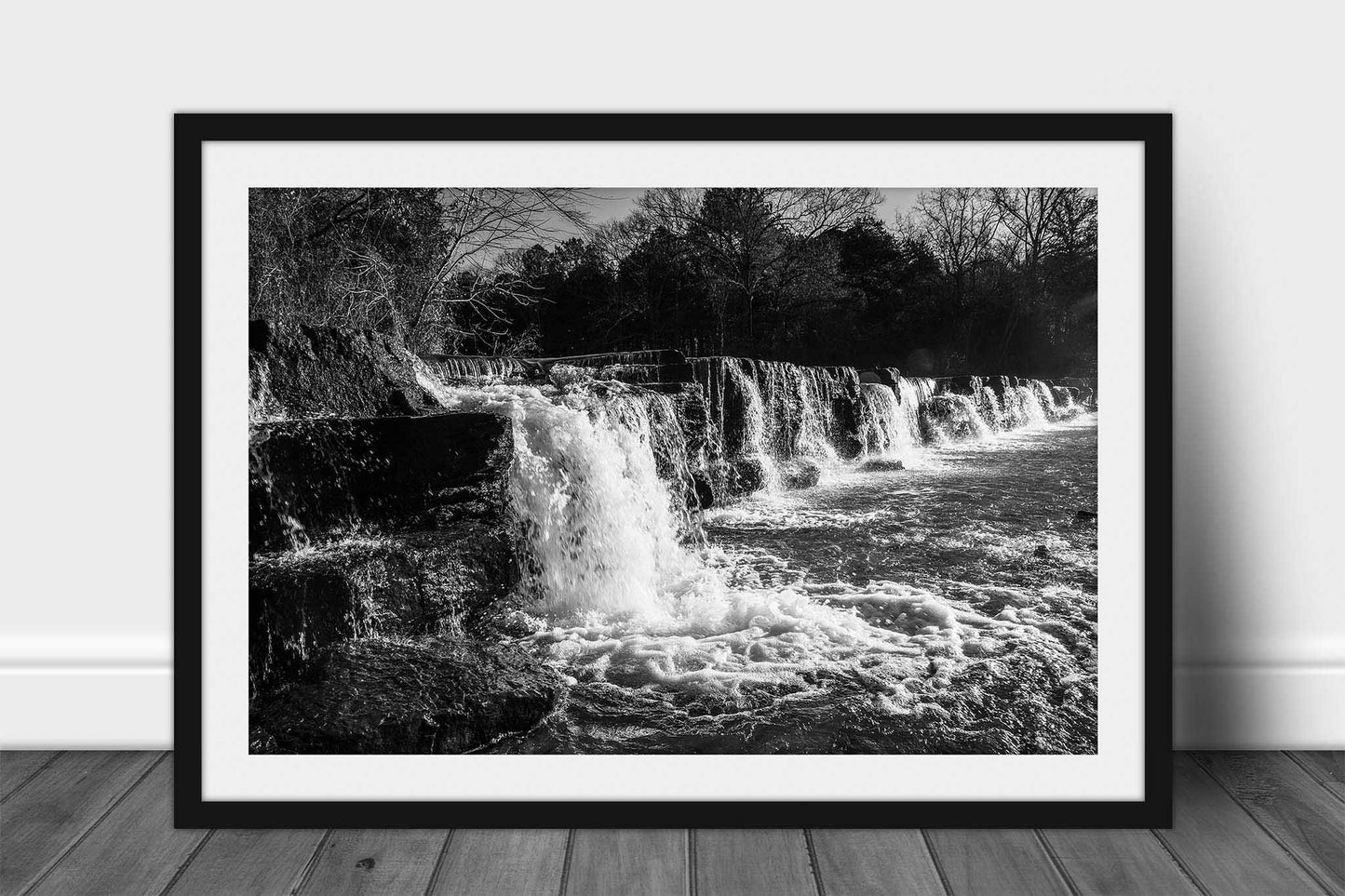 Framed and matted black and white waterfall print of Mountain Fork Creek crossing over the rock ledges of Natural Dam Falls on a winter day in the Ozark Mountains of Arkansas by Sean Ramsey of Southern Plains Photography.