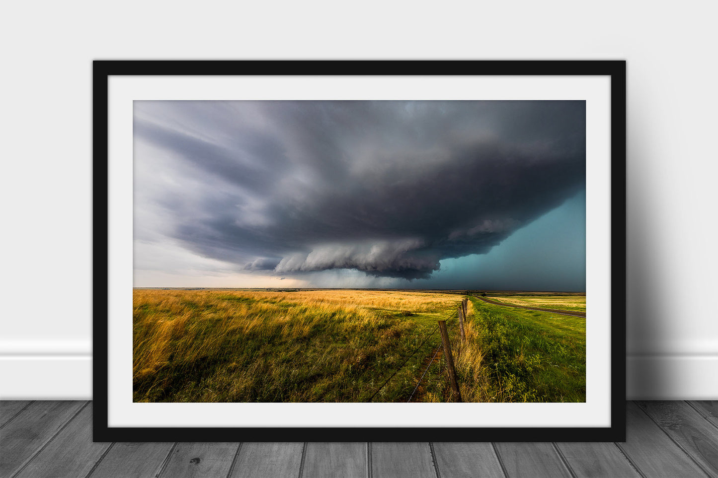 Framed and matted storm print of a supercell thunderstorm developing over open prairie on a spring day in Oklahoma by Sean Ramsey of Southern Plains Photography.