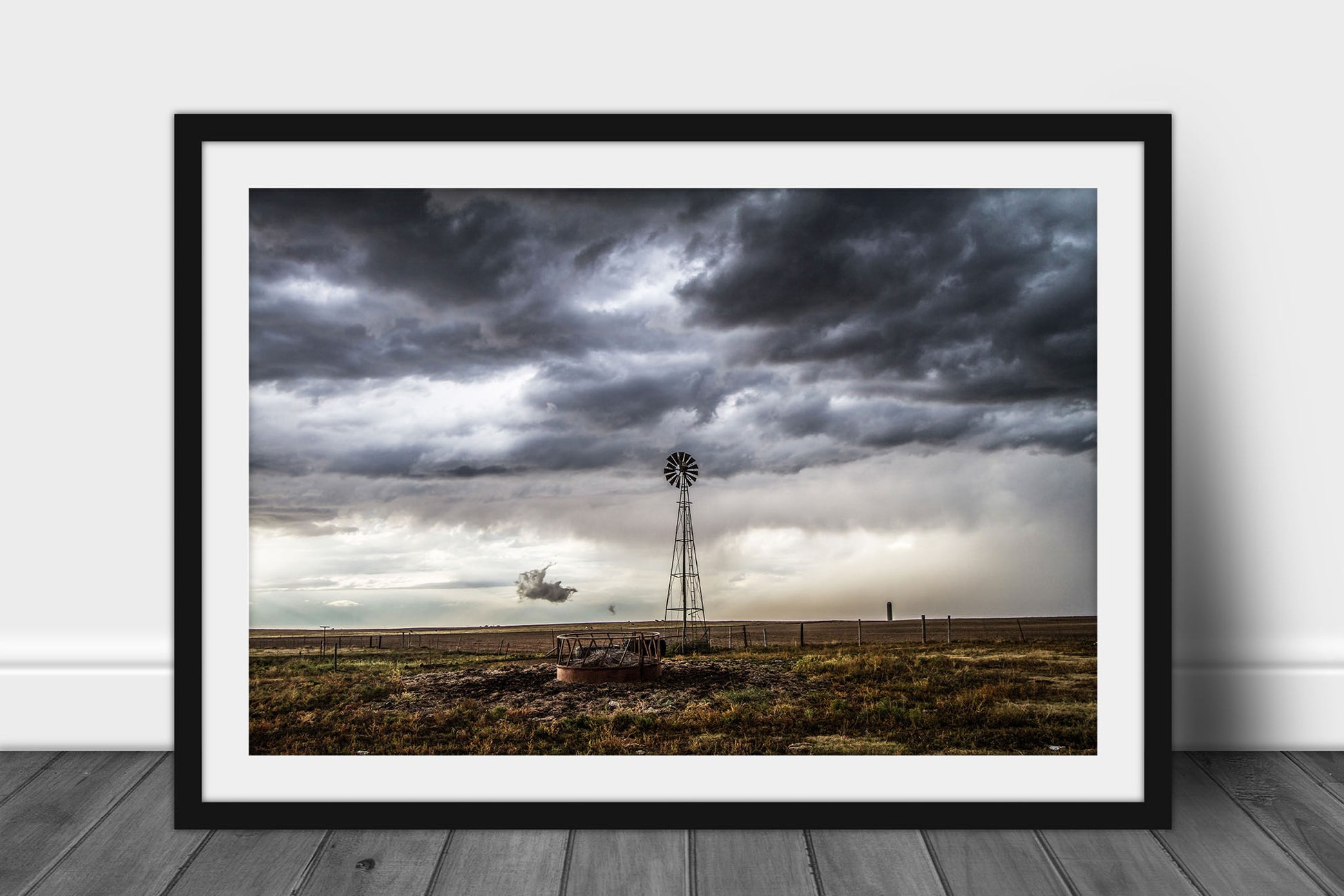 Framed and matted country print of an old windmill underneath a stormy sky on a spring day in the Oklahoma panhandle by Sean Ramsey of Southern Plains Photography.