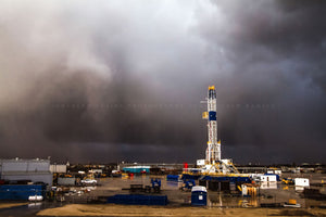 Oilfield photography print of a drilling rig standing tall as an intense storm pushes through on a stormy spring day in Oklahoma by Sean Ramsey of Southern Plains Photography.