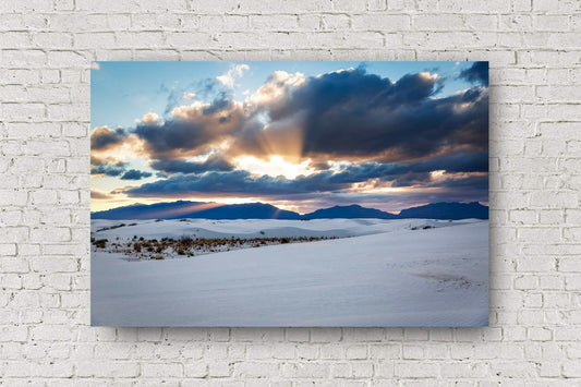Desert landscape metal print of sunbeams bursting from behind clouds over the San Andres Mountains at sunset in White Sands National Park near Alamogordo, New Mexico by Sean Ramsey of Southern Plains Photography.