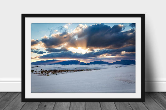 Framed and matted desert print of sunbeams bursting from behind clouds over the San Andres Mountains at sunset in White Sands National Park, New Mexico by Sean Ramsey of Southern Plains Photography.