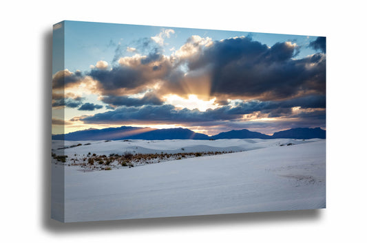 Desert southwest canvas wall art of sunbeams bursting from behind clouds over the San Andres Mountains at sunset at White Sands National Park, New Mexico by Sean Ramsey of Southern Plains Photography.