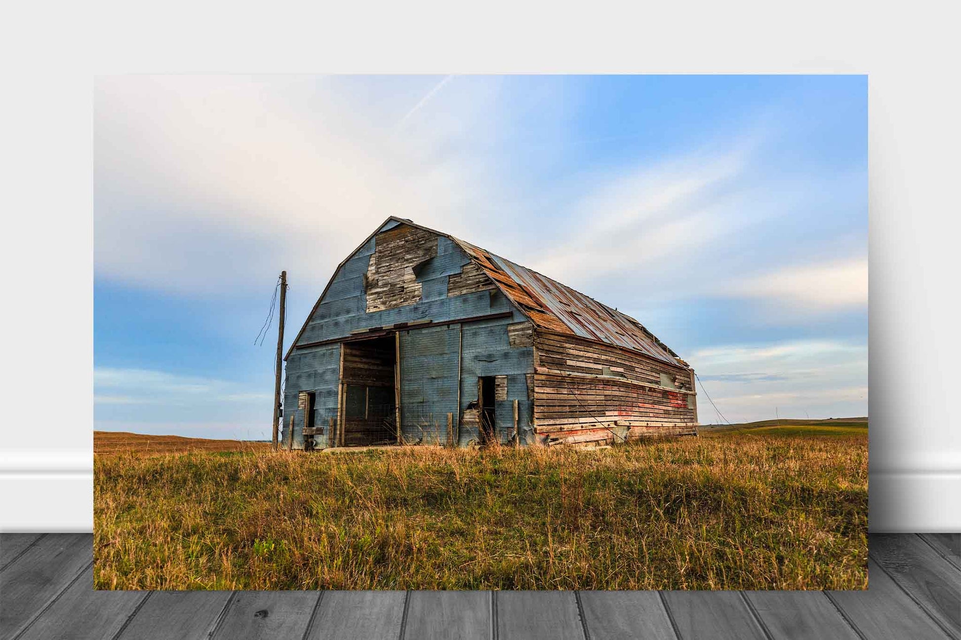Rural Midwest aluminum metal print wall art of an old barn covered by a patchwork of tin in the Nebraska Sandhills by Sean Ramsey of Southern Plains Photography.
