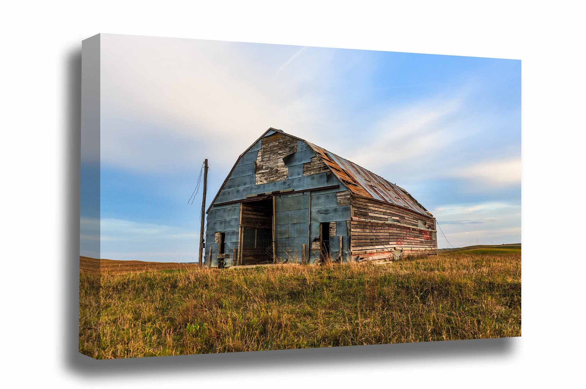Rural Midwest gallery wrapped canvas wall art of an old barn covered by a patchwork of tin in the Nebraska Sandhills by Sean Ramsey of Southern Plains Photography.