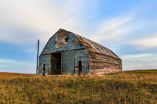 Rural Midwest photography print of an old barn covered by a patchwork of tin in the Nebraska Sandhills by Sean Ramsey of Southern Plains Photography.