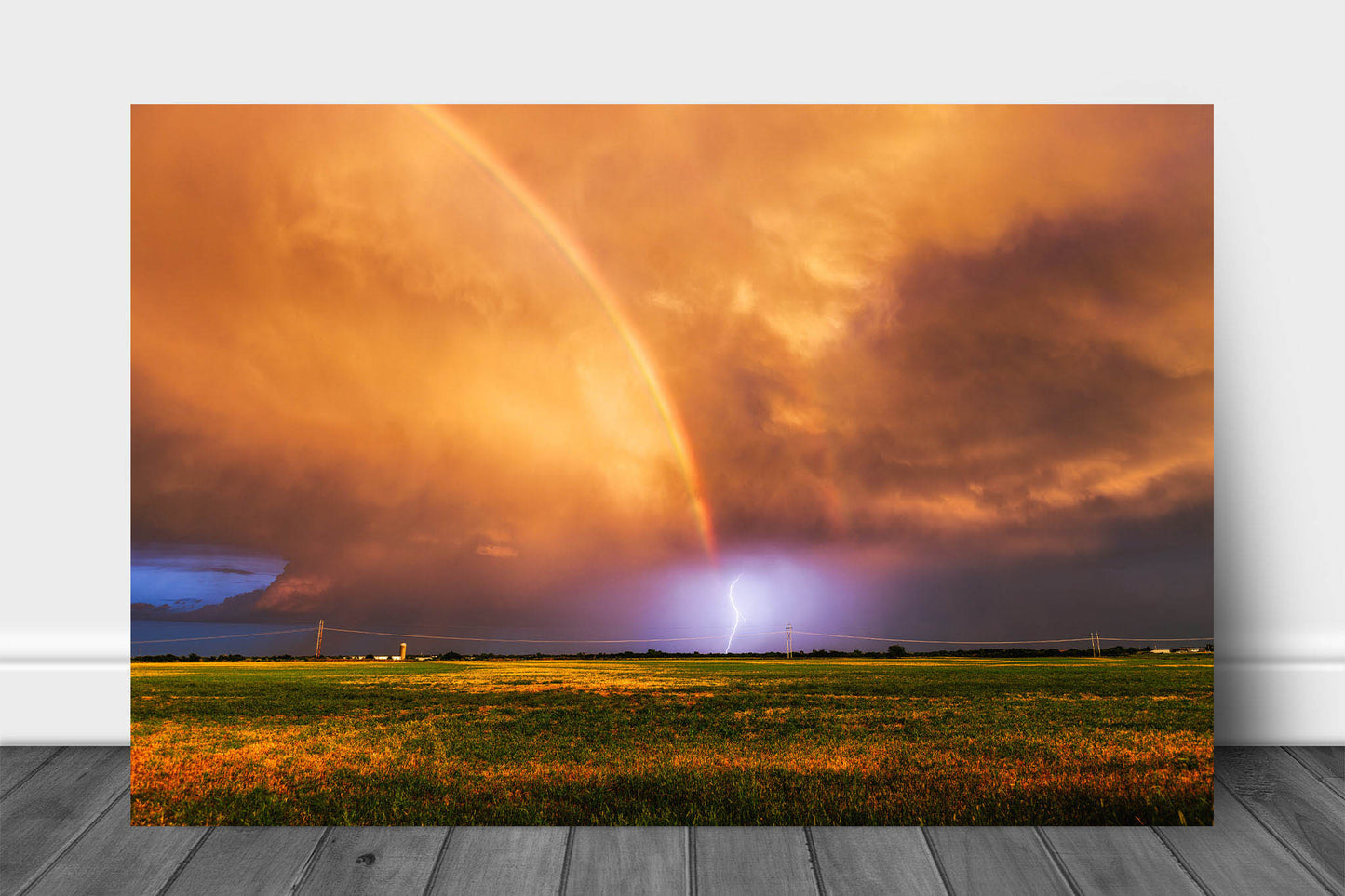 Storm metal print wall art of a lightning bolt at the end of a vibrant rainbow at sunset on a stormy evening in Oklahoma by Sean Ramsey of Southern Plains Photography.